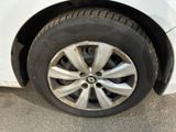 a close up of a tire on a white car