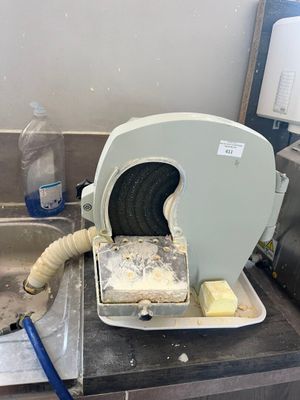 a machine that is sitting on a counter in a kitchen