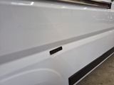 a white van with a black stripe on the side of it