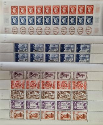 several different types of stamps are on top of a piece of paper