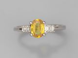 a yellow sapphire and diamond ring