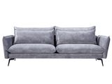 un canapé gris sur lequel sont posés deux coussins