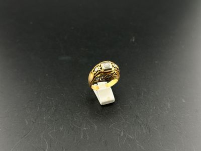 a gold ring with a white stone in the middle of it
