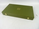 a green box that is sitting on a white table