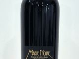 a bottle of wine that is sitting on a table
