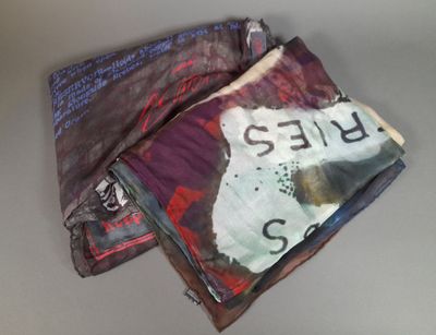 a pile of papers that have been folded up on a table