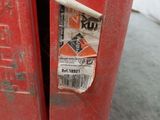 a red fire hydrant that has a sticker on it