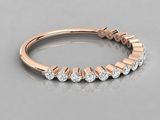 a rose gold wedding band with five diamonds