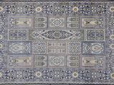a blue and beige rug with a pattern on it