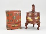 pair of asian red and gold decorated jewelry boxes and a wooden box