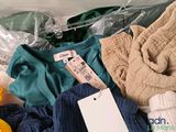 a pile of clothes that is sitting on a table