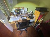 a desk with a chair and a computer on it