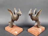 pair of antique bronze bird bookends on marble bases