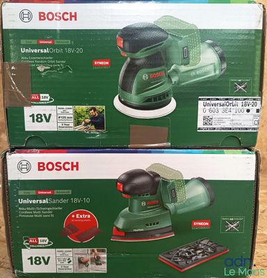 two boxes of bosch orbital sander sitting on a wooden surface
