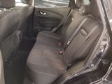 the back seats of a car are empty in a parking lot