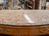 a table with a marble top on it in a store