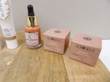 three different types of skin care products sitting on a table