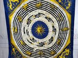 a blue and yellow scarf hanging on a wall