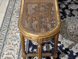 a table and two chairs on a rug in a room