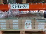 a large stack of boxes on a pallet in a warehouse