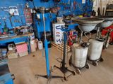 a picture of a garage with a lot of tools on the floor