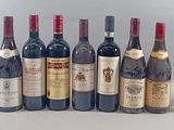many bottles of wine lined up on a table