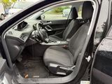 the interior of a car with the door open showing the driver ' s seat