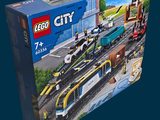 a box of lego city trains on the tracks