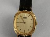an image of a gold plated wrist watch