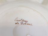 a close up of a white plate with writing on it