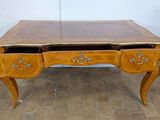 a small desk with two drawers on top of it