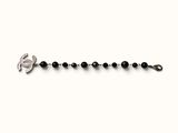 a close up of a black beaded bracelet with a silver clasp