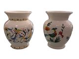 two vases sitting side by side on a white background