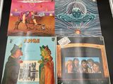 an image of a collection of various album covers on a table