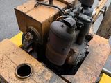 a small machine that is sitting on the side of the road