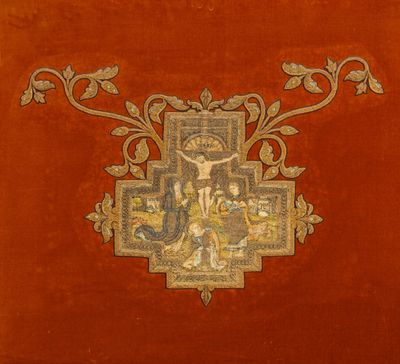 painting of a cross on a red velvet surface with a gold border