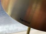 a close up of a lamp that is on a window sill