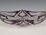 a close up of a glass bowl on a white surface