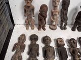 a lot of wooden figurines sitting on a table