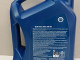 a blue gallon of motor oil sitting on a table