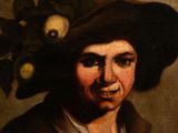 portrait of a young man in a hat with a skull on his head