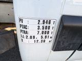 a close up of a white truck with a sign on it