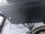 a computer desk with a keyboard and a monitor on top of it