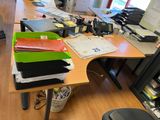 a desk with a lot of papers on it