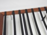a close up of a rack with ties hanging on it