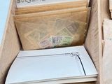 a wooden box filled with lots of different types of mail