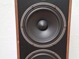 a close up of a pair of speakers sitting on top of a table