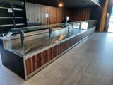 a glass display case in the middle of a store