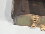 a small metal box with a key inside of it