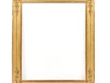 an antique gold frame on a white background